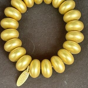 NEW PLUNDER Golden, egg-shaped beaded bracelet